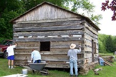 Chinking the Log House.